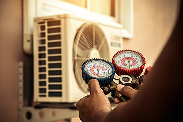 Professional Heat Pump Repair technician working in Cave Springs, AR
